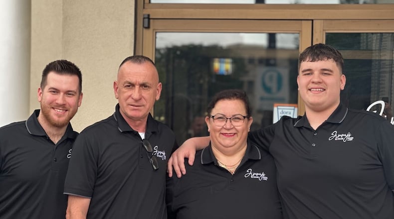 The Jusufi Family at the grand opening of their Jimmy’s Italian restaurant in the Oregon District in May 2024. They are (left to right) son Albert, a recent Wright State grad; parents Mo and Mira; son Doni, a Fairmont High junior who wrestles for the Firebirds. CONTRIBUTED