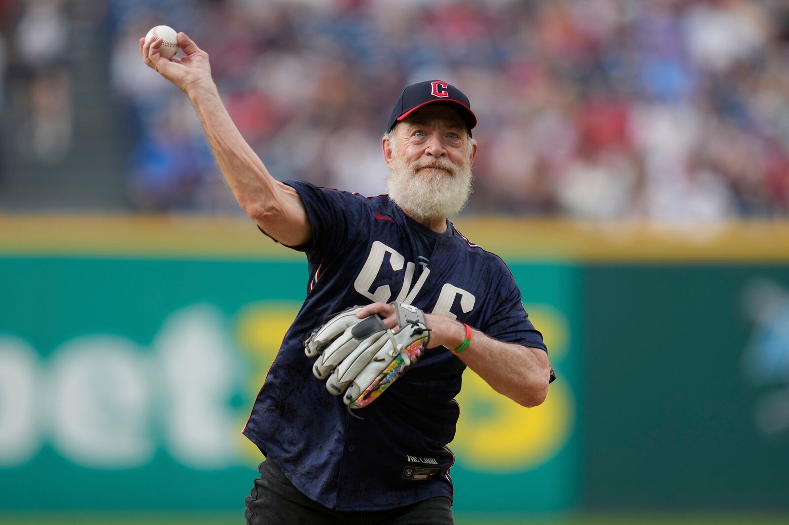 Actor J.K. Simmons throws out a ceremonial first pitch before a baseball game between the St.Louis Cardinals and the Cleveland Guardians in Cleveland, Friday, June 27, 2025. (AP Photo/Sue Ogrocki)