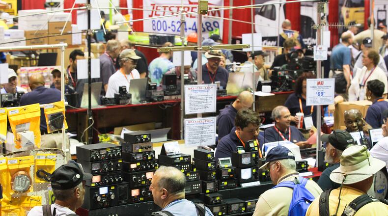 The Hara Arena floor fills up on opening day Friday, May 17, of the Dayton Hamvention 2013. The annual convention devoted to radio technology is expected to bring about 25,000 amateur radio enthusiasts to the Hara Complex in Trotwood before the show ends Sunday. CHRIS STEWART / STAFF
