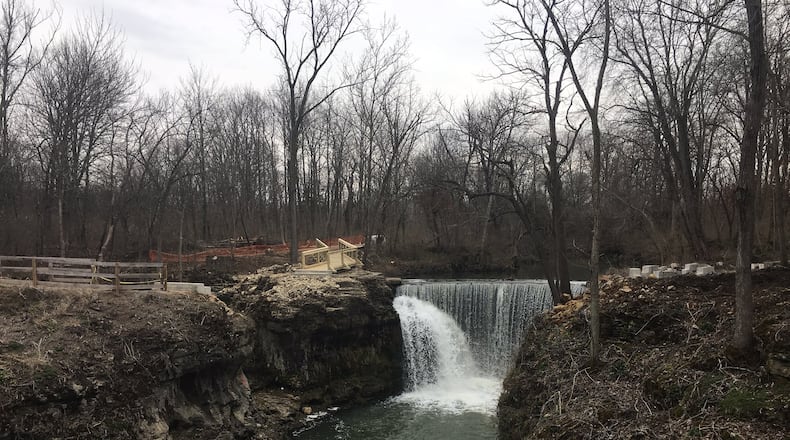 Work is nearing completion on a bridge and overlook deck that will allow visitors to get closer to the rushing waters of Cedar Cliff Falls. The project is the last piece of an overall plan to improve the Indian Mound Reserve park in Greene County. RICHARD WILSON/STAFF