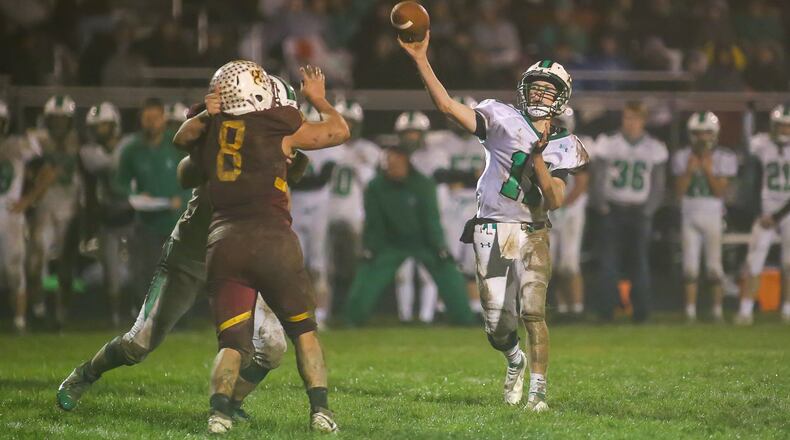 Anna High School junior quarterback Carter Seigle throws the ball during their game against Northeastern on Saturday night at Conover Field in Springfield. The Rockets won 17-3. CONTRIBUTED PHOTO BY MICHAEL COOPER
