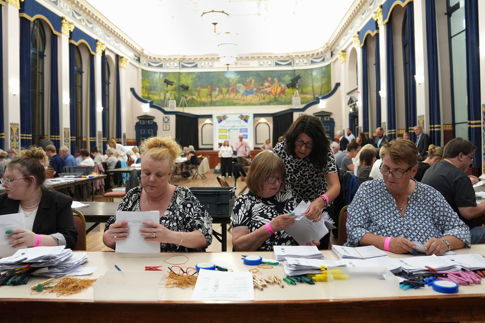 Votes are counted at Grimsby Town Hall, in Lincolnshire, England, for the Greater Lincolnshire Mayor election, early Friday, May 2, 2025. (Joe Giddens/PA via AP)