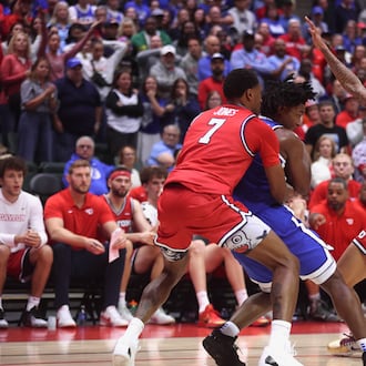 Dayton's De'Shayne Montgomery, left, and Keonte Jones apply defensive pressure in the final minute against Brigham Young on Friday, Nov. 28, 2025, at the State Farm Field House in Kissimmee, Fla. David Jablonski/Staff