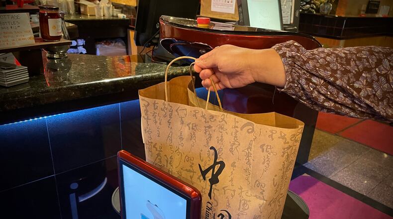 China Cottage on Far Hills Avenue in Centerville is using a robot to help with carryout orders. NATALIE JONES/STAFF