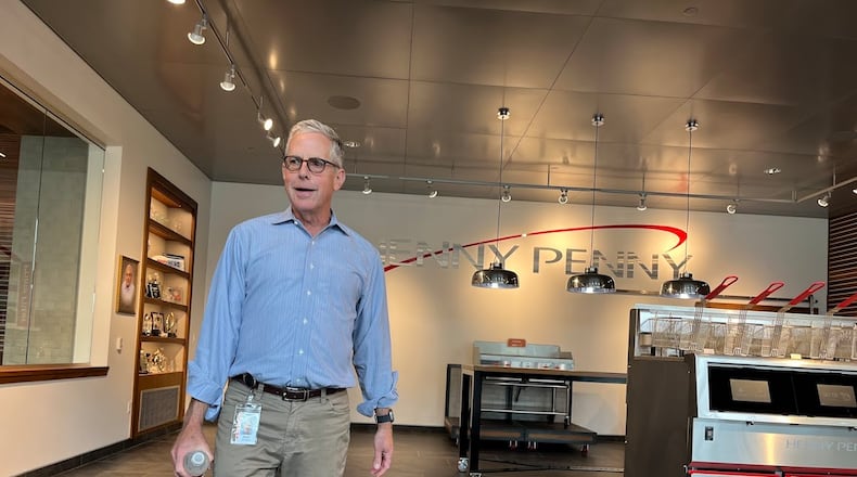Rob Connelly, executive chairman of Henny Penny, gives guests a tour of one of the company's buildings off U.S. 35 in Eaton. THOMAS GNAU/STAFF