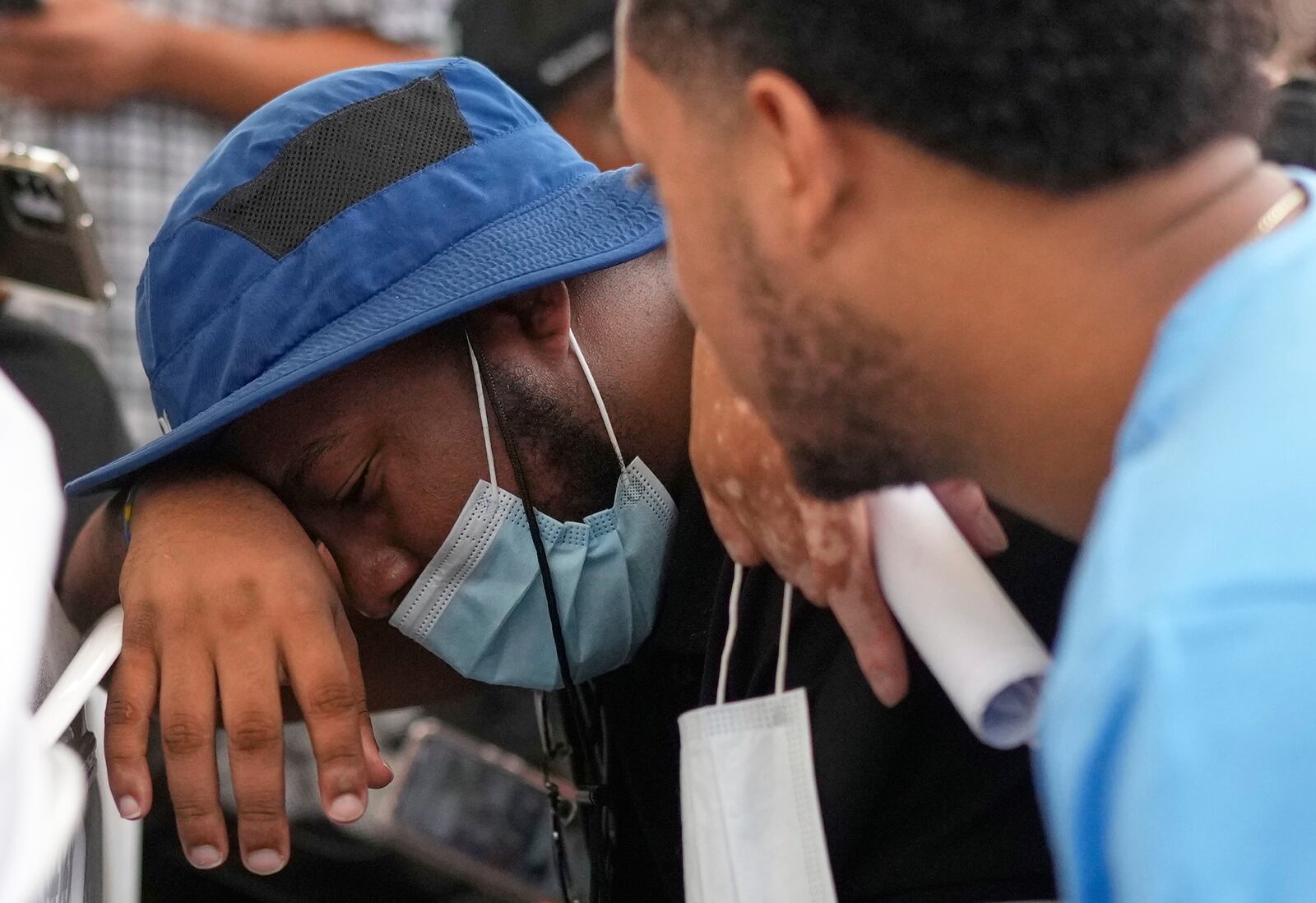 Family members wait at the morgue for the bodies of their loved one who died at the roof collapse of the Jet Set nightclub, where more than 200 people died, outside at the National Institute of Forensic Pathology in Santo Domingo, Dominican Republic, Friday, April 11, 2025. (AP Photo/Matias Delacroix)