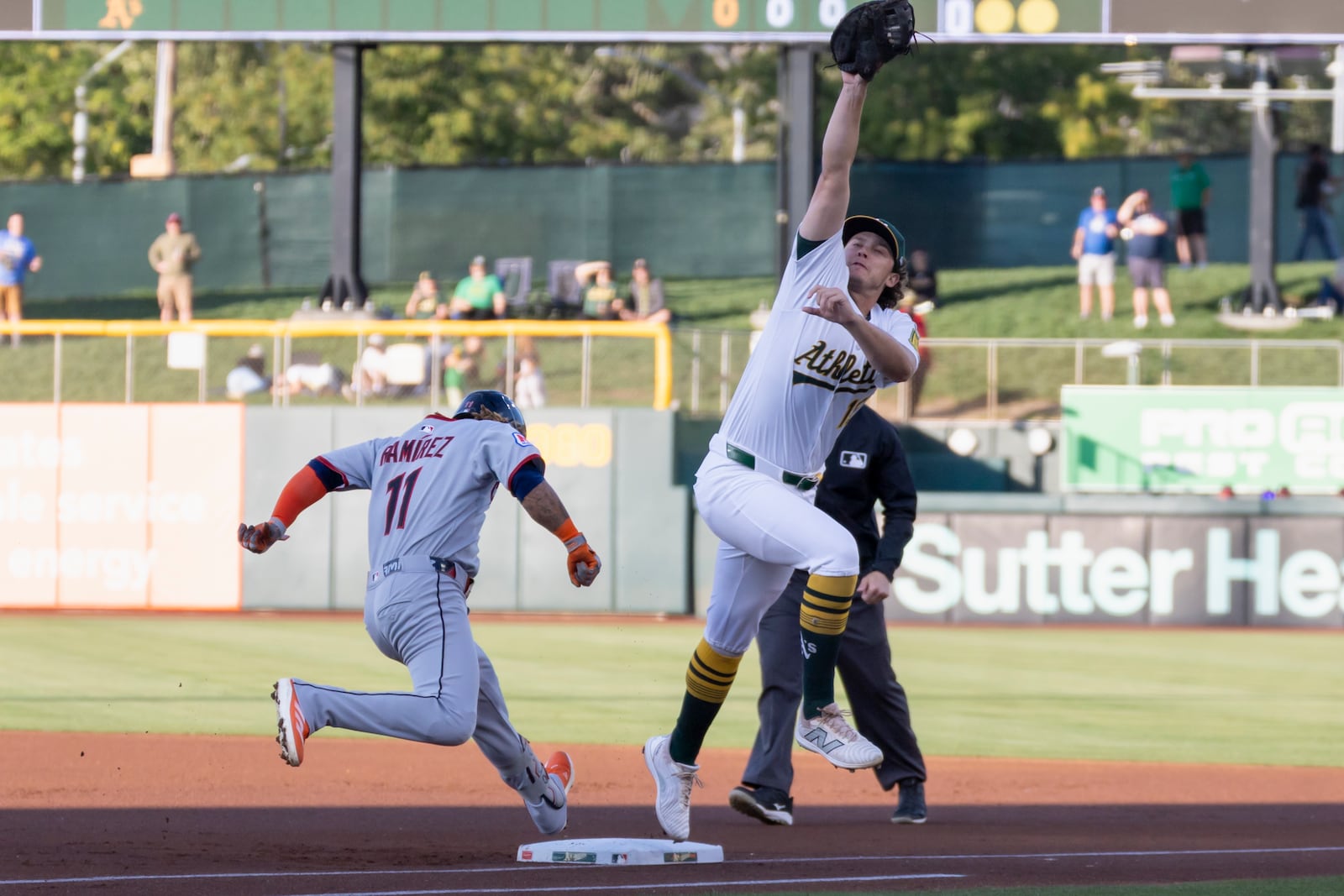 Athletics first baseman Nick Kurtz, front right, forces out Cleveland Guardians' José Ramírez (11) during the first inning of a baseball game Friday, June 20, 2025, in West Sacramento, Calif. (AP Photo/Sara Nevis)
