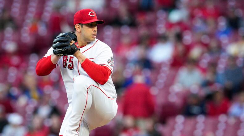 Cincinnati Reds relief pitcher Luis Cessa winds up during the first inning of the team's baseball game against the Chicago Cubs on Tuesday, Oct. 4, 2022, in Cincinnati. (AP Photo/Jeff Dean)