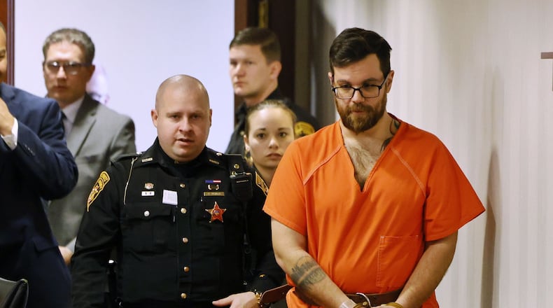 John Carter, charged with murder in the death case of Katelyn Markham, enters the Butler County Common Pleas Court on Monday, March 27, 2023. NICK GRAHAM/STAFF
