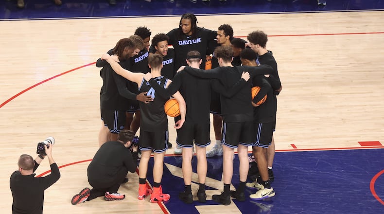 Dayton huddles before a game against Richmond on Tuesday, March 3, 2026, at the Robins Center in Richmond, Va. David Jablonski/Staff
