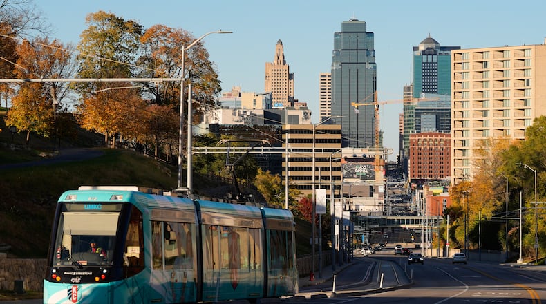 A streetcar runs along Main Street near the 18th and Vine district Friday, Nov. 7, 2025, in Kansas City, Mo. (AP Photo/Charlie Riedel)