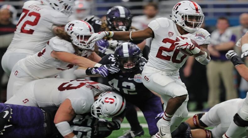 Stanford running back Bryce Love (20) carries on a 15-yard touchdown run against Texas Christian in the Valero Alamo Bowl at the Alamodome in San Antonio, Texas, on December 28, 2017. (Rodger Mallison/Fort Worth Star-Telegram/TNS)