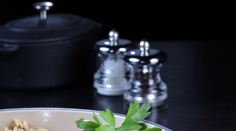 Sauteed mushrooms and fresh rosemary add depth to a classic rice pilaf. (Food styling by Joan Moravek.) (Abel Uribe/Chicago Tribune/TNS)