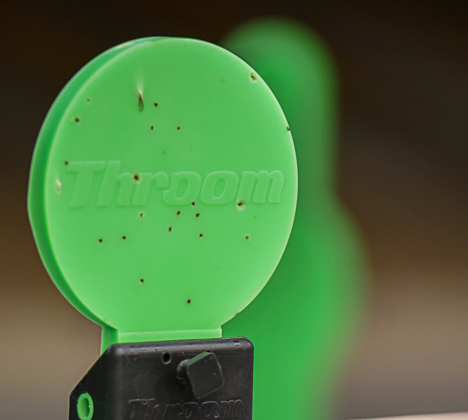 The 88th Security Forces Squadron’s new targets give the shooter instant visual feedback. The neon green targets are made of a self-sealing lightweight polymer material that allows the bullet to pass through while also flipping over when hit. U.S. AIR FORCE PHOTO/MATTHEW CLOUSE