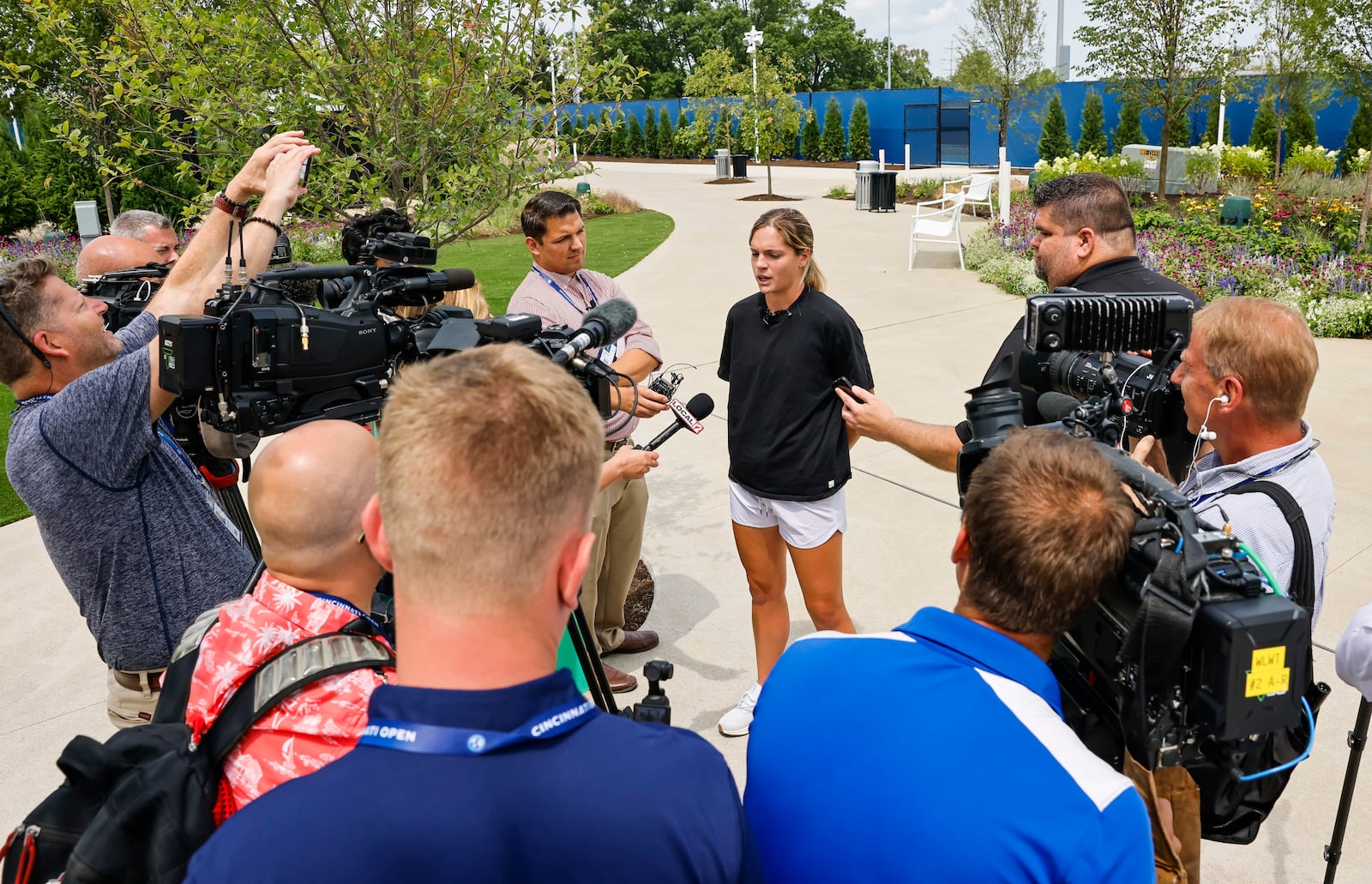 Local tennis player Caty McNally speaks to media during a tour of the Lindner Family Tennis Center in Mason, home of the Cincinnati Open, which has undergone a $260 million renovation to double the size of the campus to 40 acres, increase amenities for fans and players, add 10 new sunken practice courts with better views for fans and more. NICK GRAHAM/STAFF 