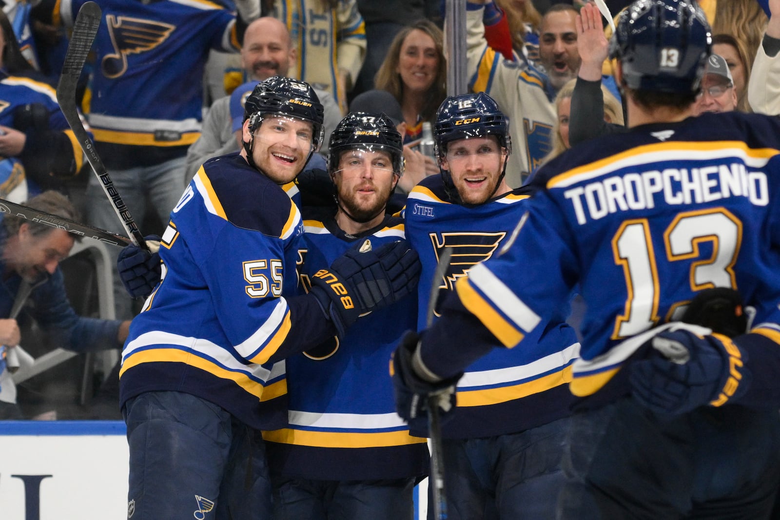 St. Louis Blues defenseman Cam Fowler (17) is congratulated by teammates after scoring against the Winnipeg Jets during the second period in Game 6 of an NHL hockey first-round playoff series Friday, May 2, 2025, in St. Louis. (AP Photo/Jeff L)