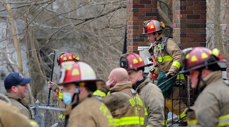 Dayton Fire Department firefighters battled a blaze at 633 Ferguson Avenue Monday morning. District Chief Fred Haney said crews encountered flames at the back of the structure and was able to suppress it there. He said the home was furnished but empty at the time of the fire. He said the fire is under investigation. MARSHALL GORBY\STAFF