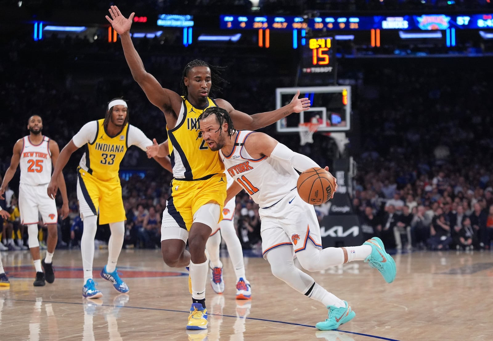 New York Knicks guard Jalen Brunson (11) drives against Indiana Pacers guard Andrew Nembhard (2) during the third quarter of Game 2 of the NBA basketball Eastern Conference final, Friday, May 23, 2025, in New York. (AP Photo/Frank Franklin II)