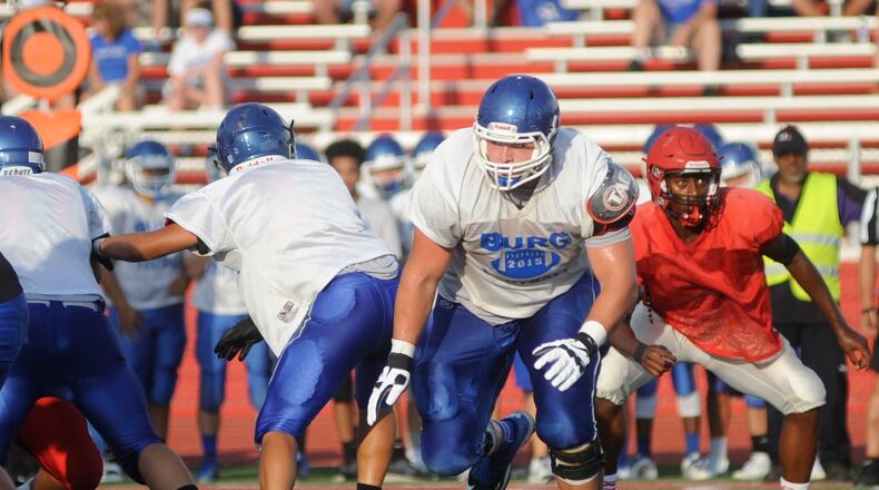 Miamisburg senior offensive linemen Josh Myers (middle) during a scrimmage at Trotwood-Madison on Friday, Aug. 19, 2016. MARC PENDLETON / STAFF