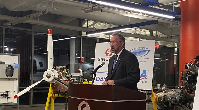 Sinclair Community College president Steve Johnson speaks at an event in December 2021 announcing a new Aircraft Mechanic Training Facility at the Dayton International Airport. Eileen McClory / staff