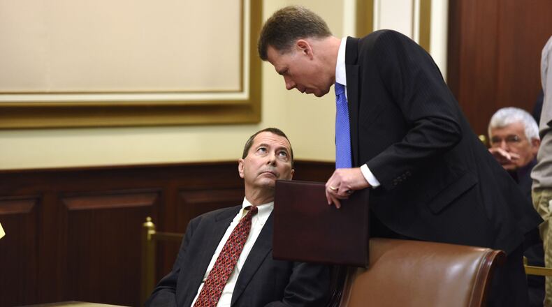 Pete Beck, left, talks to his attorney, Ralph Kohnen, after the verdicts were read.
