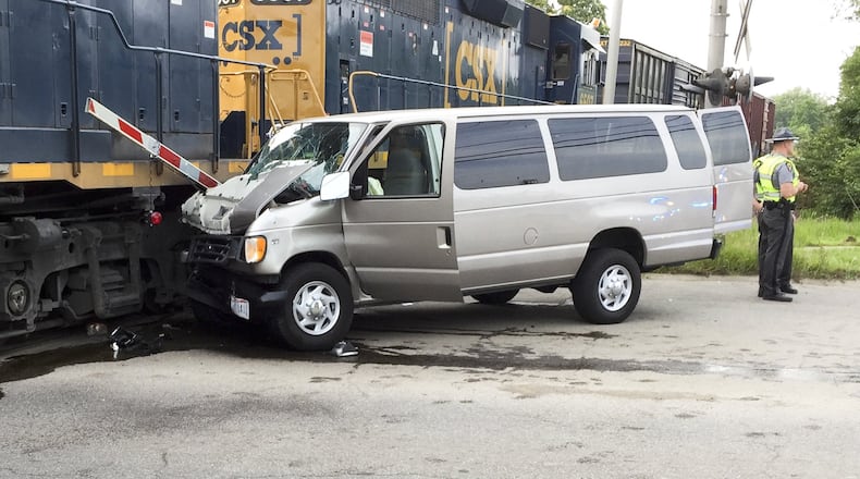 One woman was killed and several children were injured July 28 when the van they were driving to vacation Bible school at their Middletown church hit a train at the intersection of University Boulevard and 14th Avenue. ED RICHTER/STAFF