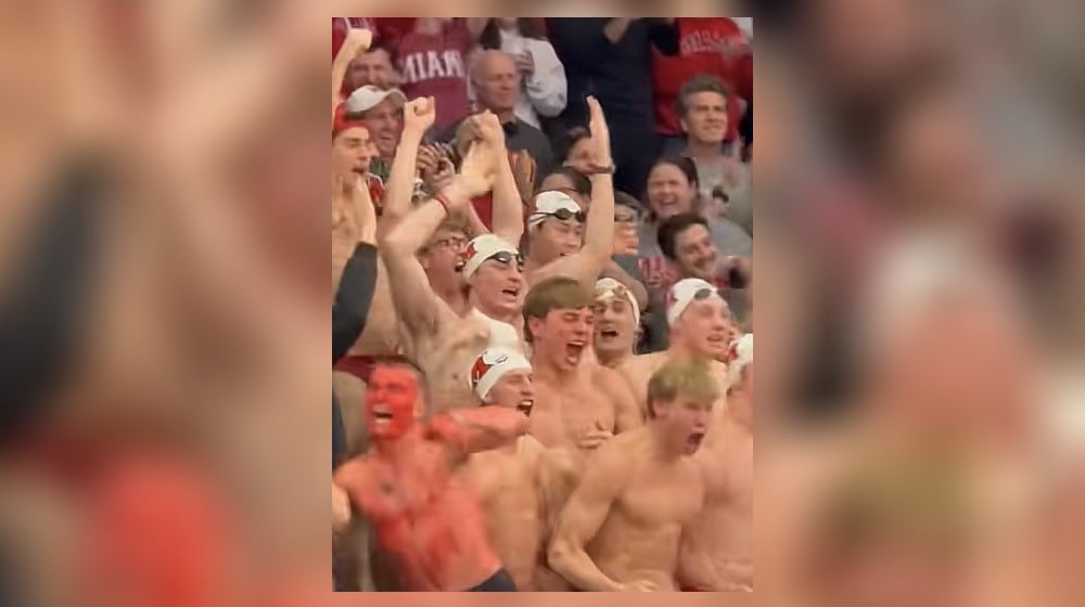 The Miami University's men's swim team is seen in the crowd at the March 18, 2026 First Four basketball team where Miami played SMU, and won. STAFF