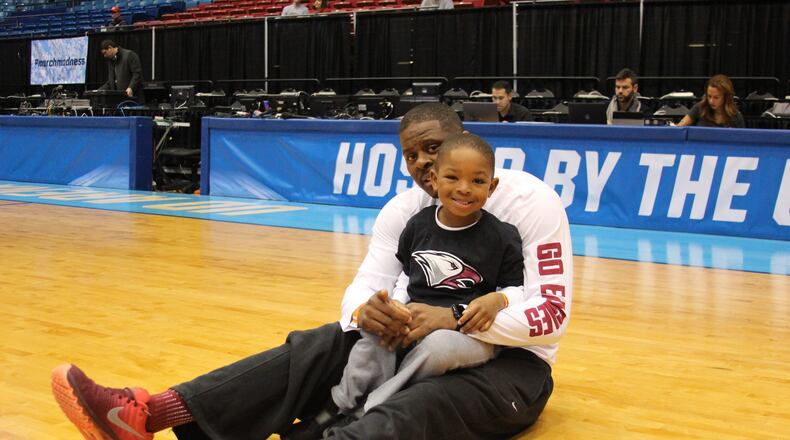 North Carolina Central coach LeVelle Moton and son V.J. (LeVelle Jr.) stretch at UD Arena during Tuesday’s practice for a First Four game Wednesday against UC Davis. Photo courtesy North Carolina Central University Athletics