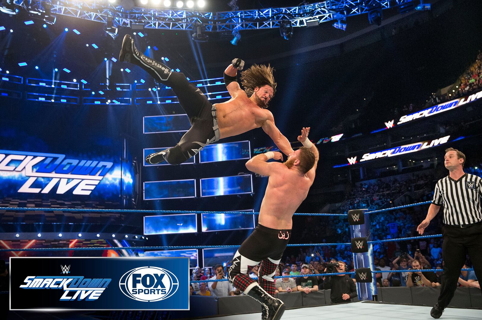 Two wrestlers competing in a match for WWE. USA Today
