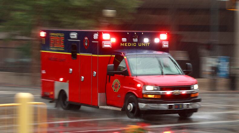 A Springfield Fire Division medic unit races through the rain in route to a call in this July 6, 2023, photo. BILL LACKEY/STAFF