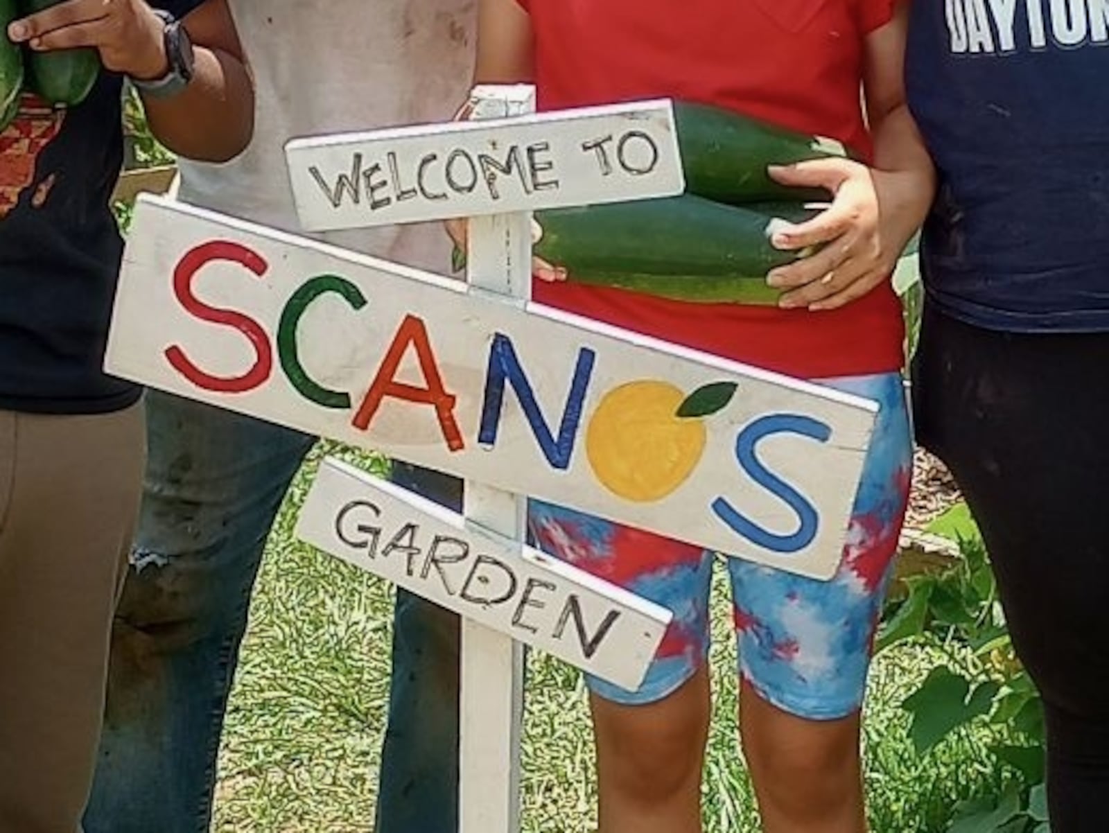 A sign reading "Welcome to Scano's Garden" stands in DeVann Carter's garden in 2025. "Scano" has been Carter's nickname since he was a child. CONTRIBUTED