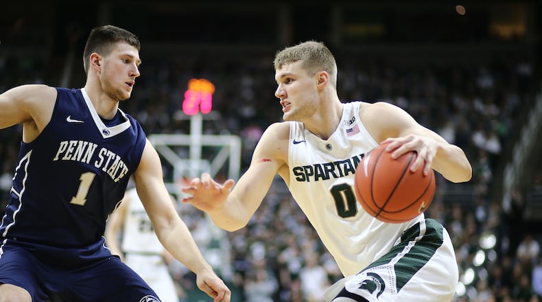 EAST LANSING, MI - FEBRUARY 28: Kyle Ahrens #0 of the Michigan State Spartans drives baseline against Deividas Zemgulis #1 of the Penn State Nittany Lions in the second half at the Breslin Center on February 28, 2016 in East Lansing, Michigan. (Photo by Rey Del Rio/Getty Images)