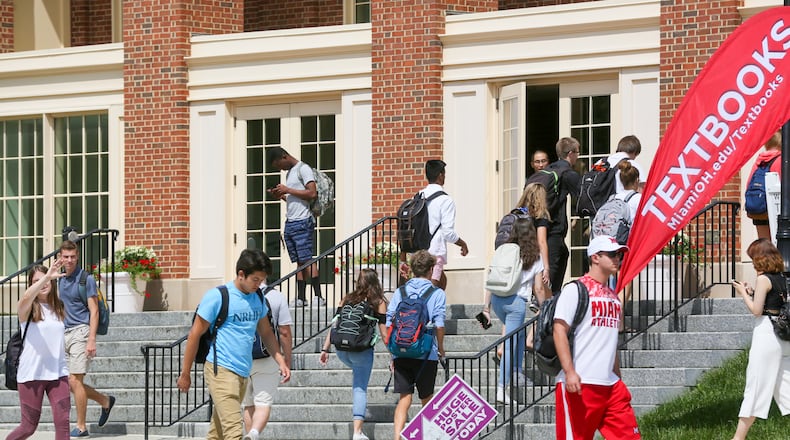 Students walk between class periods on the campus of Miami University in Oxford, Wednesday, Aug. 30, 2017. GREG LYNCH / STAFF
