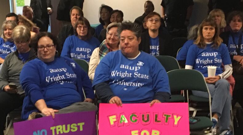 Wright State University faculty union members showed up with signs to a board of trustees meeting Friday. The union members are protesting ongoing contract negotiations with the administration.