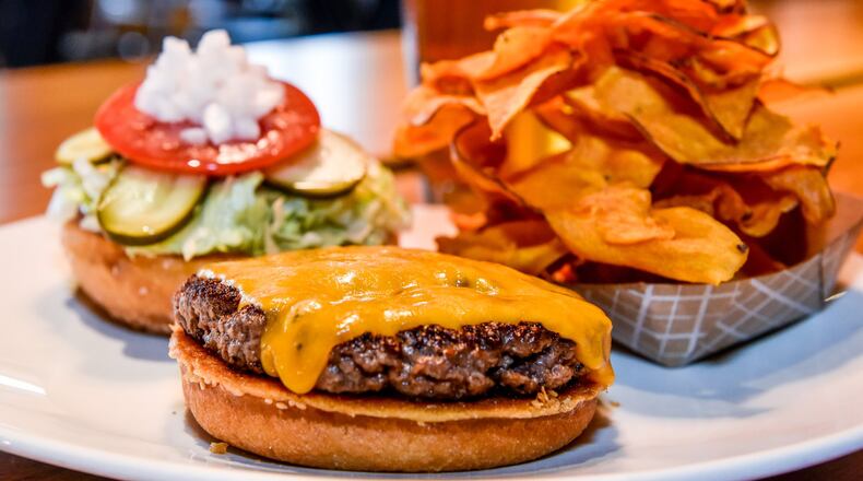 Northstar Café’s cheeseburger made from Niman Ranch brisket and chuck, ground in-house daily, topped with cheddar, lettuce, tomato, onion and pickle served with housemade sweet potato chips.