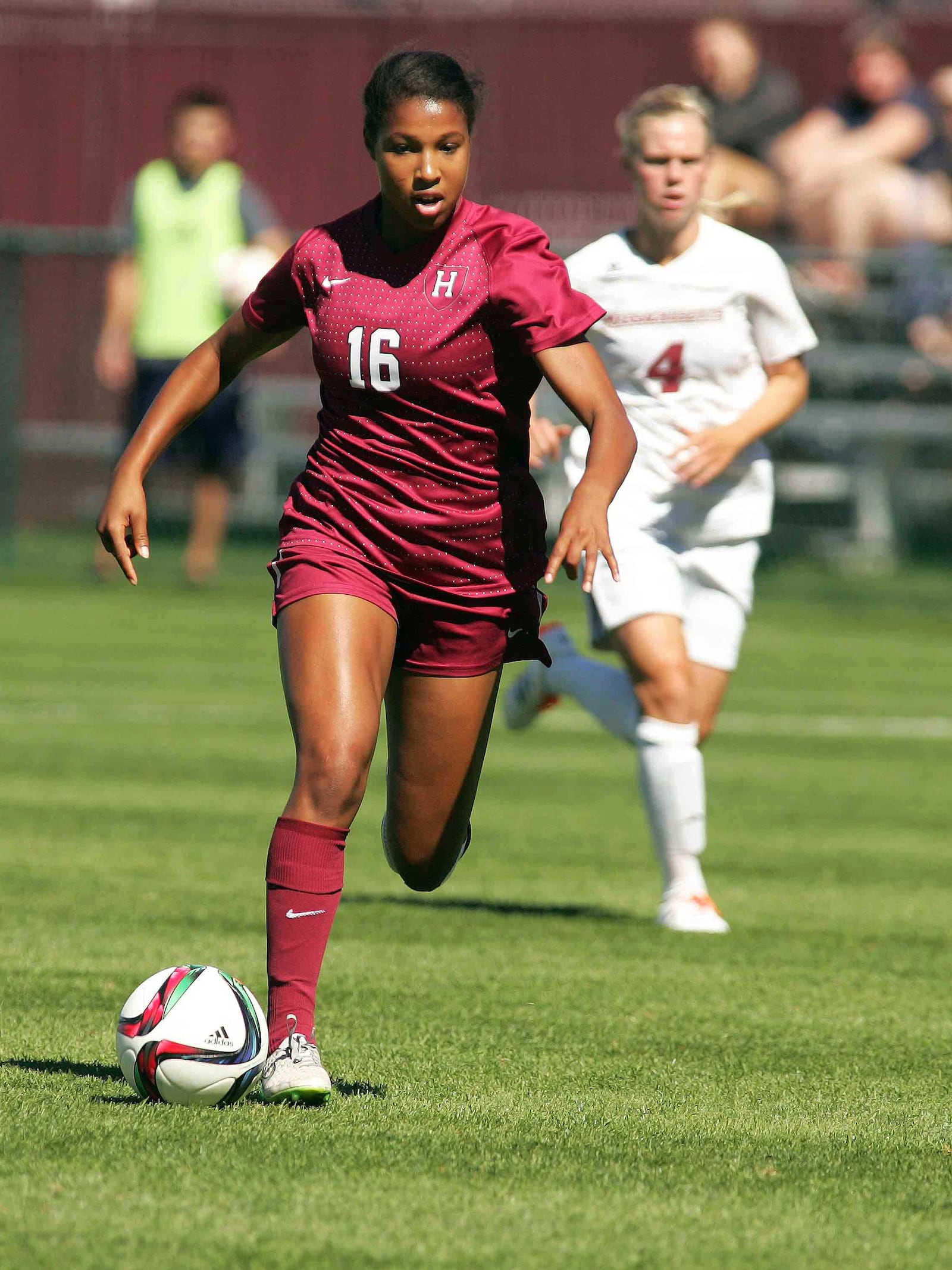 FILE - Harvard's Margaret Purce, left, kicks the ball past Massachusetts' Rebekka Sverrisdottir in the first half of an NCAA college soccer game Sunday, Sept. 20, 2015, in Amherst, Mass. (J. Anthony Roberts/The Republican via AP, File)