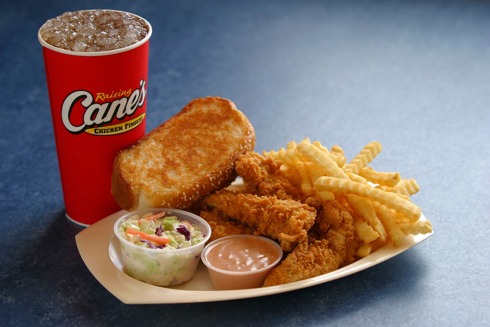 Raising Cane’s menu includes chicken fingers, crinkle-cut fries, cole slaw, Texas Toast and Cane s Sauce. The restaurant chain plans to open a location in Butler County next summer.