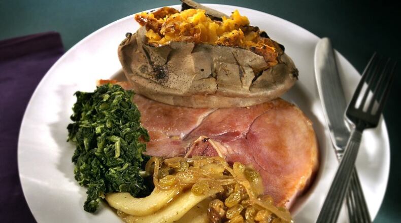 Ham steaks get a sweet accompaniment from fresh pears glazed in butter and plump golden raisins. (Bob Fila/Chicago Tribne/TNS)