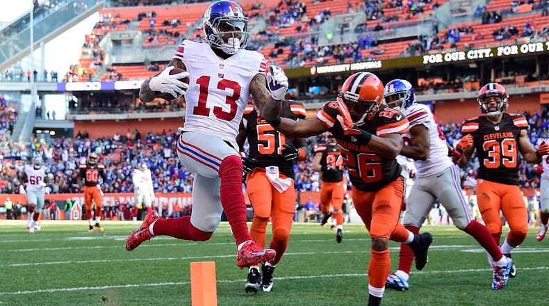CLEVELAND, OH - NOVEMBER 27: Odell Beckham #13 of the New York Giants scores a second quarter touchdown in front of Marcus Burley #26 of the Cleveland Browns at FirstEnergy Stadium on November 27, 2016 in Cleveland, Ohio. (Photo by Jason Miller/Getty Images)