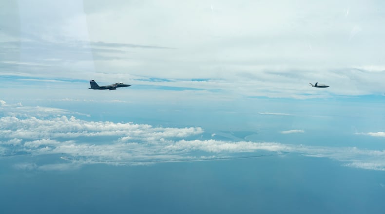 An F-15E Strike Eagle from the 96th Test Wing’s 40th Flight Test Squadron at Eglin AFB, Florida flies in formation with an XQ-58A Valkyrie flown by artificial intelligence agents developed by the Autonomous Air Combat Operations, or AACO, team from AFRL.  (U.S. Air Force photo)