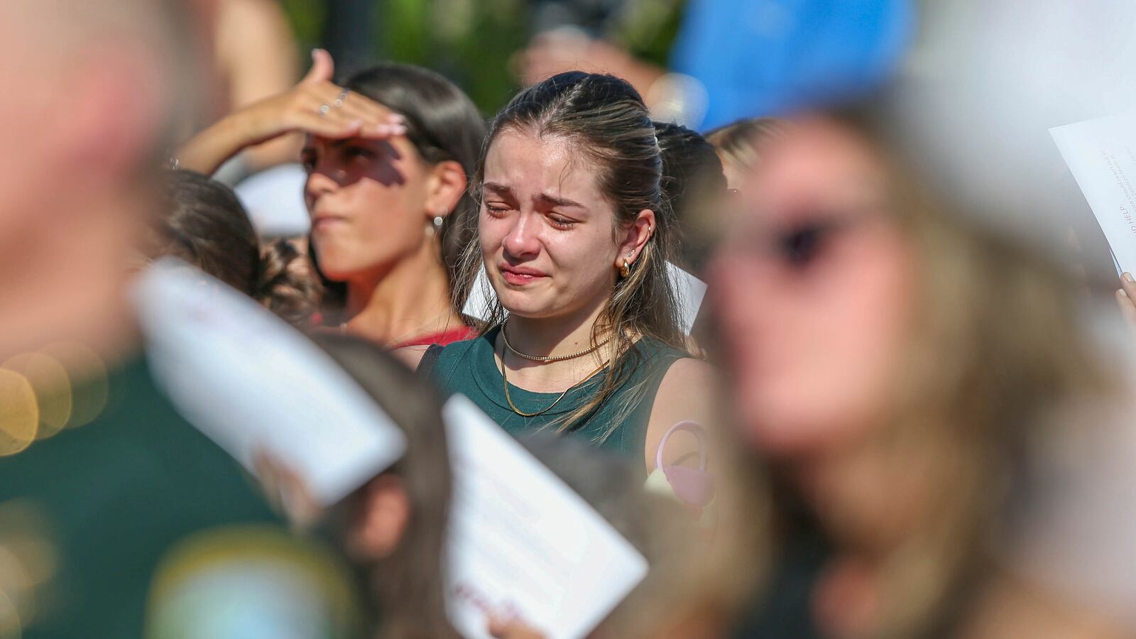 A student mourns during a vigil on the Florida State campus at Langford Green, Tallahassee, Fla., Friday, April 18, 2025. (AP Photo/Gary McCullough)
