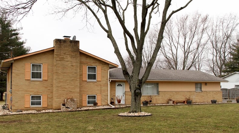 The 3-bedroom house sits on a 1-acre property with a fenced back yard, extra-wide driveway with parking pad and a heated, 2-car attached garage. The lower level has a family room with a brick, wood-burning fireplace. CONTRIBUTED PHOTOS BY KATHY TYLER