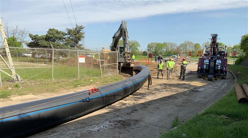 A city of Dayton crew replacing a water main pipe under the Great Miami River at the southern section of the city in 2020./ CONTRIBUTED