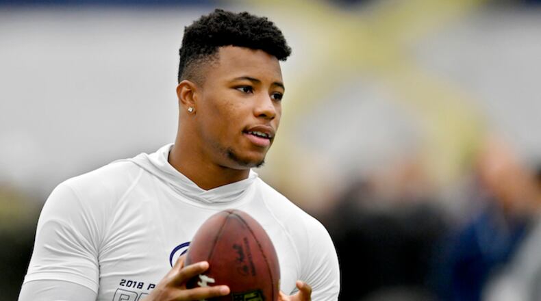 Former Penn State running back Saquon Barkley tosses a ball around during Penn State Pro Day on Tuesday, March 20, 2018, at Holuba Hall in University Park, Pa. (Abby Drey/Centre Daily Times/TNS)