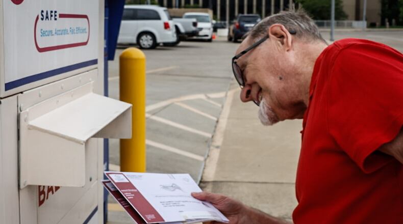 Henry Noe cast his ballot at the drop box outside of the Montgomery County Administration building Monday August 7, 2023.