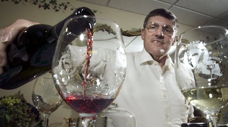 In this file photo from 2005, James Brandeberry pours a glass of his cabernet sauvignon.