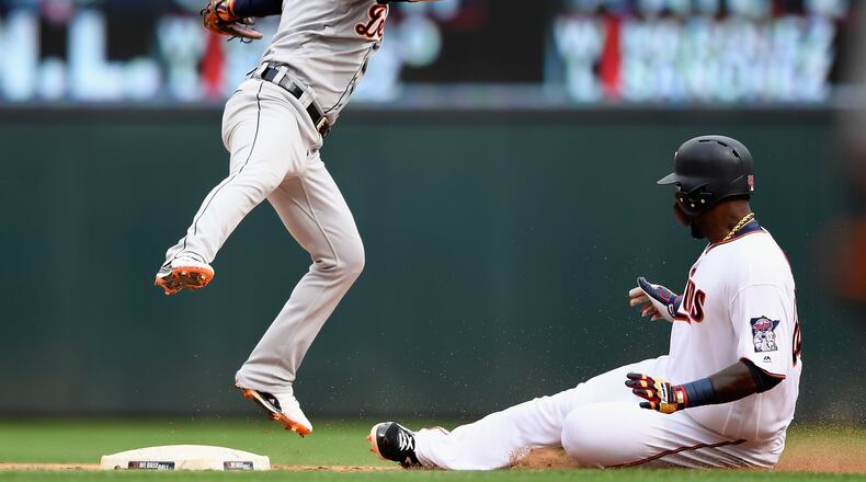 MINNEAPOLIS, MN - AUGUST 19: Miguel Sano #22 of the Minnesota Twins slides safely into second base as Jose Iglesias #1 of the Detroit Tigers fields the ball during the eighth inning of the game on August 19, 2018 at Target Field in Minneapolis, Minnesota. The Twins defeated the Tigers 5-4. (Photo by Hannah Foslien/Getty Images)
