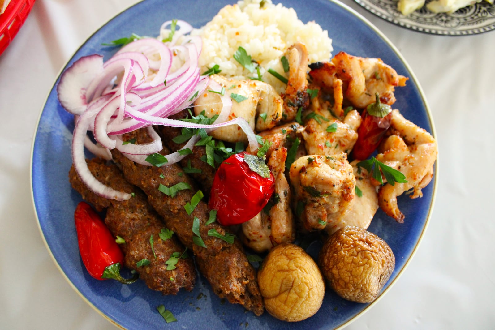 A traditional platter of kebab, rice pilaf and vegetables can be ordered at Dayton Village Pizza Restaurant on North Dixie Road. STAFF/SYDNEY DAWES