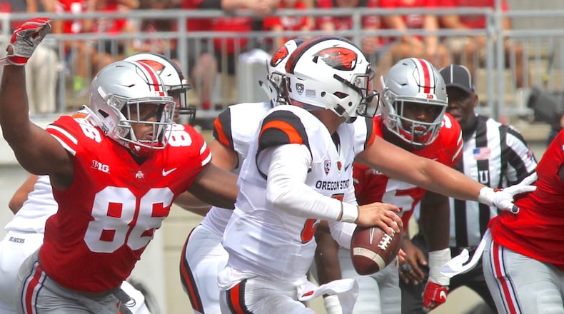 Ohio State’s Dre’Mont Jones tackles Oregon State’s Conor Blount on Saturday, Sept. 1, 2018, at Ohio Stadium in Columbus. David Jablonski/Staff