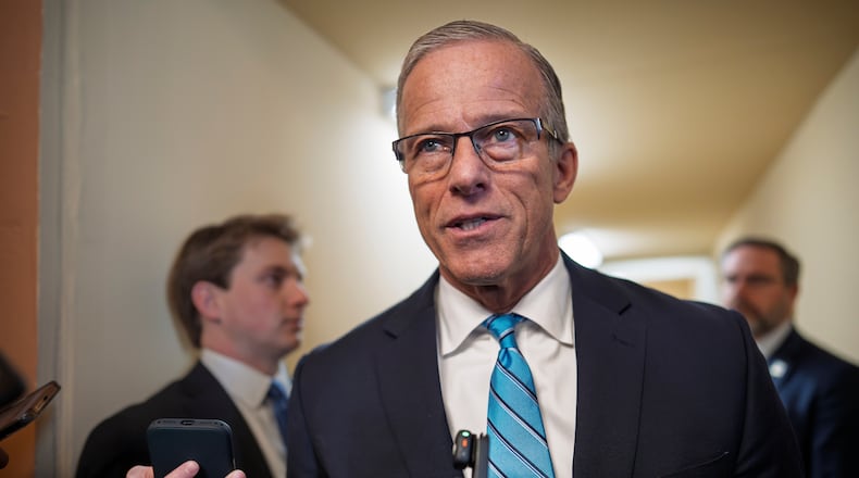 Senate Majority Leader John Thune, R-S.D., talks to reporters about a funding bill to end the shutdown of the Department of Homeland Security shutdown that began more than a month ago, at the Capitol in Washington, Monday, March 23, 2026. (AP Photo/J. Scott Applewhite)